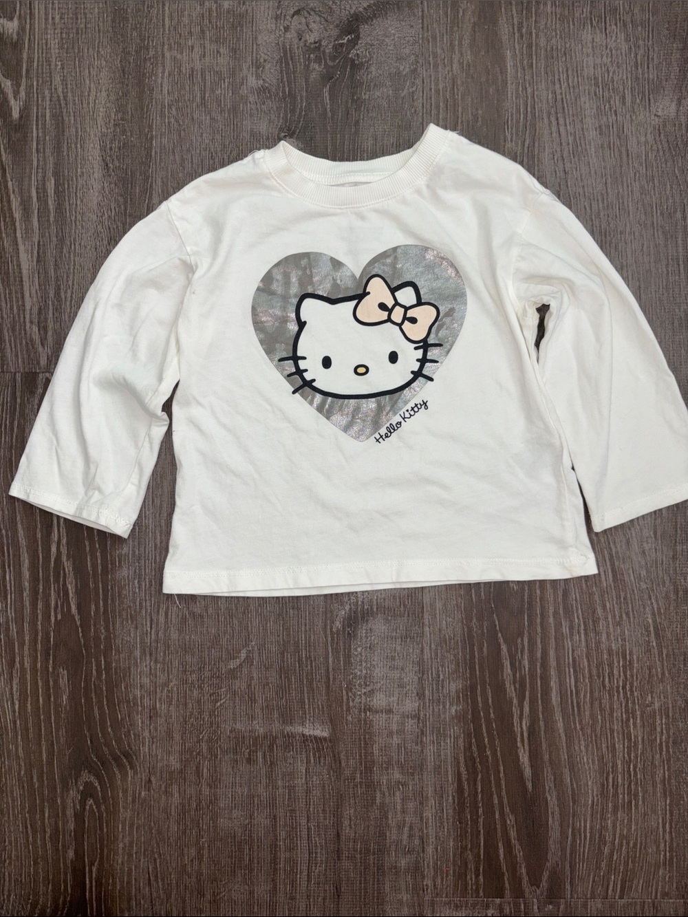 Hello Kitty Cream Long Sleeve Top with Metallic Heart and Pink Bow